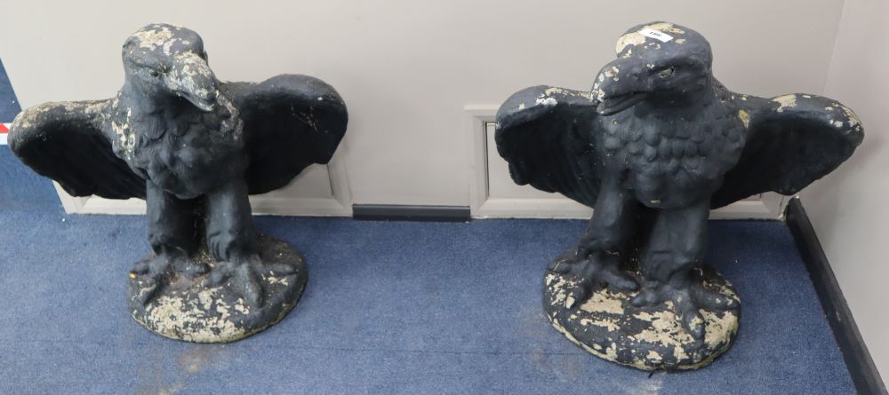 A pair of reconstituted stone eagle garden ornaments, height 78cm